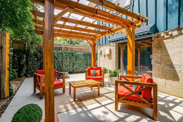 a view of a swimming pool with a patio and a yard