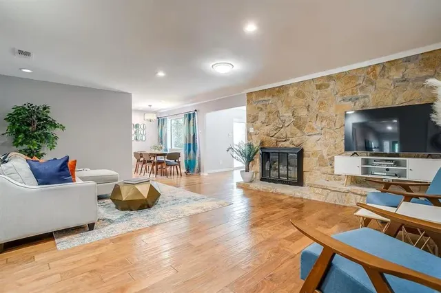 a view of a kitchen with a table and chairs