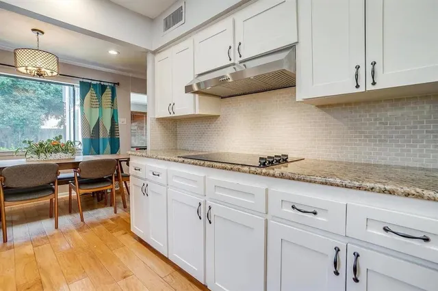 a room with a table and windows