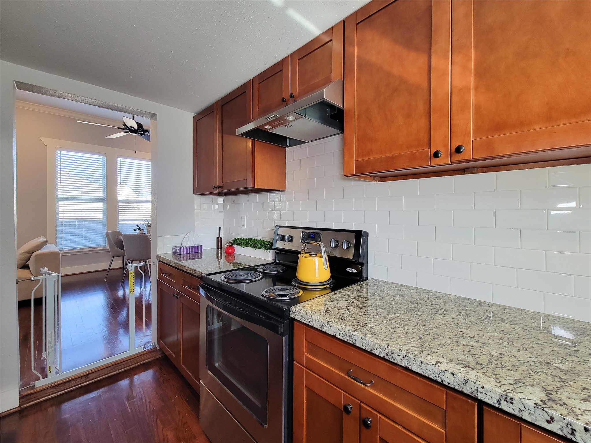 2604 Cochran Street Houston, TX 77009 - Photo 15 of 35 a kitchen with stainless steel appliances granite countertop a sink stove and cabinets
