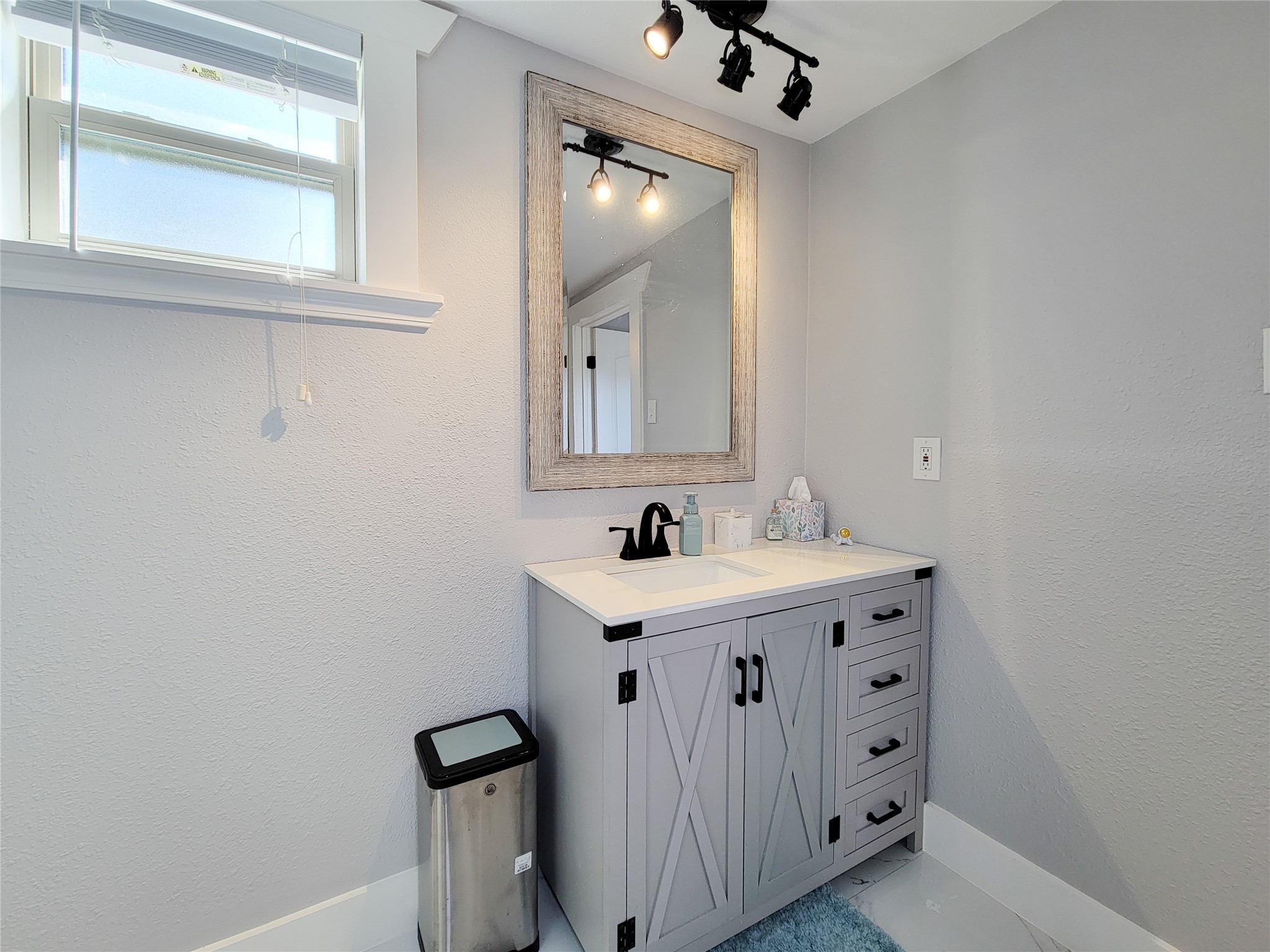 2604 Cochran Street Houston, TX 77009 - Photo 20 of 35 a bathroom with a sink vanity and mirror