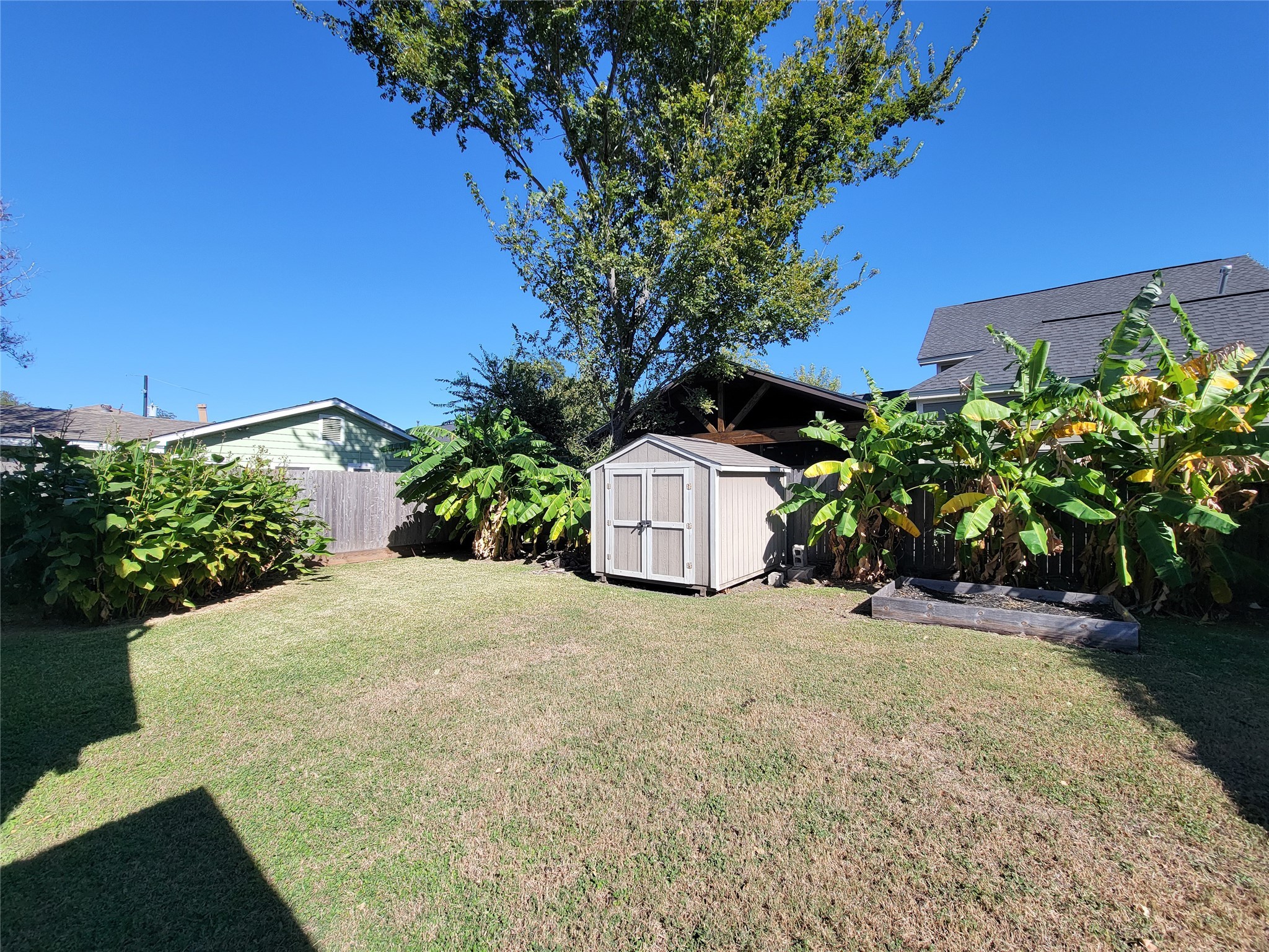 2604 Cochran Street Houston, TX 77009 - Photo 31 of 35 a view of a house with a yard and potted plants