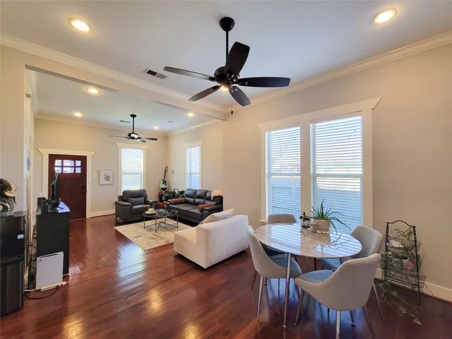 a view of a dining room with furniture window and wooden floor