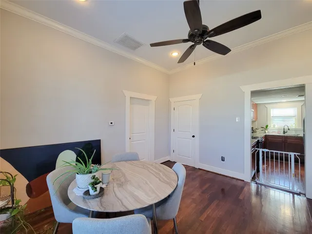 a kitchen with stainless steel appliances granite countertop a refrigerator a stove top oven a sink and dishwasher