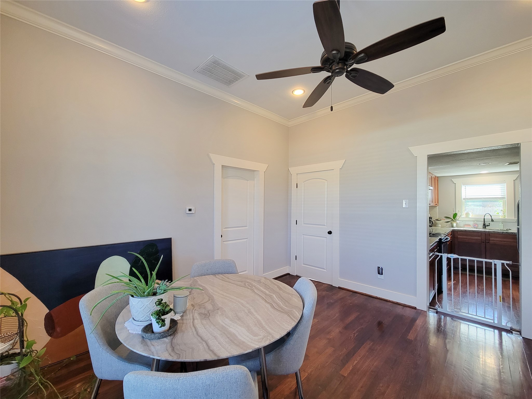 2604 Cochran Street Houston, TX 77009 - Photo 10 of 35 a workspace with furniture and wooden floor