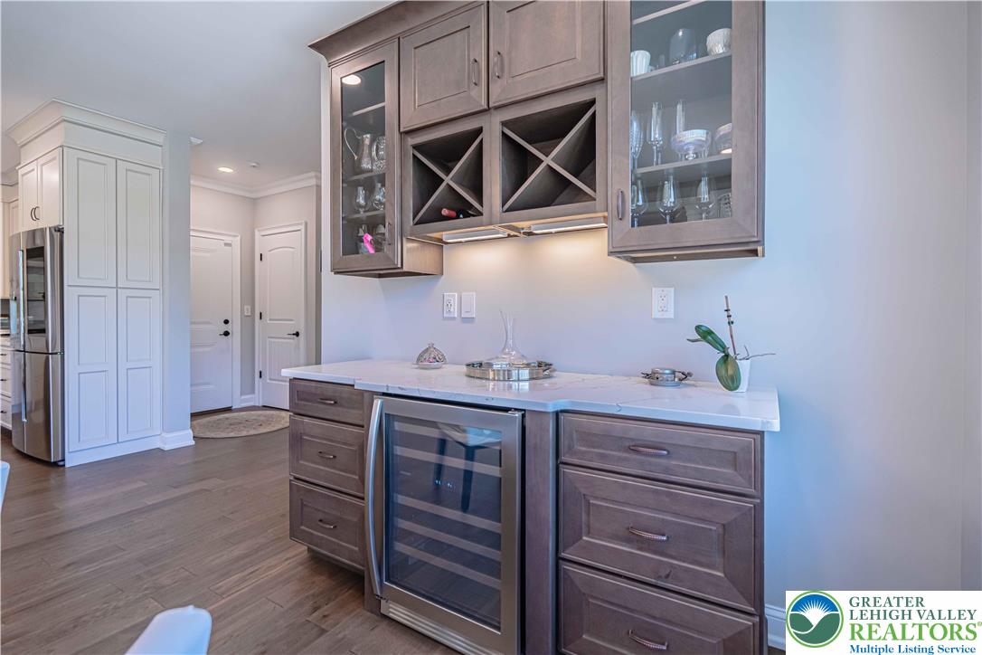 232 Cobblestone Lane Bethlehem, PA 18020 - Photo 18 of 59 a kitchen with a wooden floor and cabinets