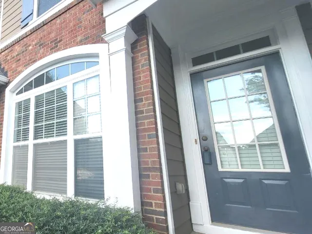 a view of a door and a window