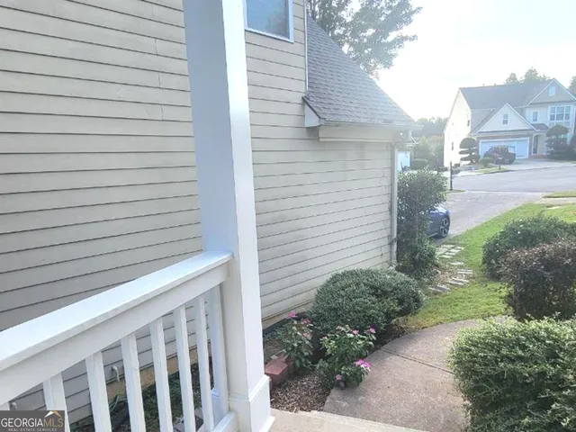 a view of a hallway with wooden floor and a fireplace