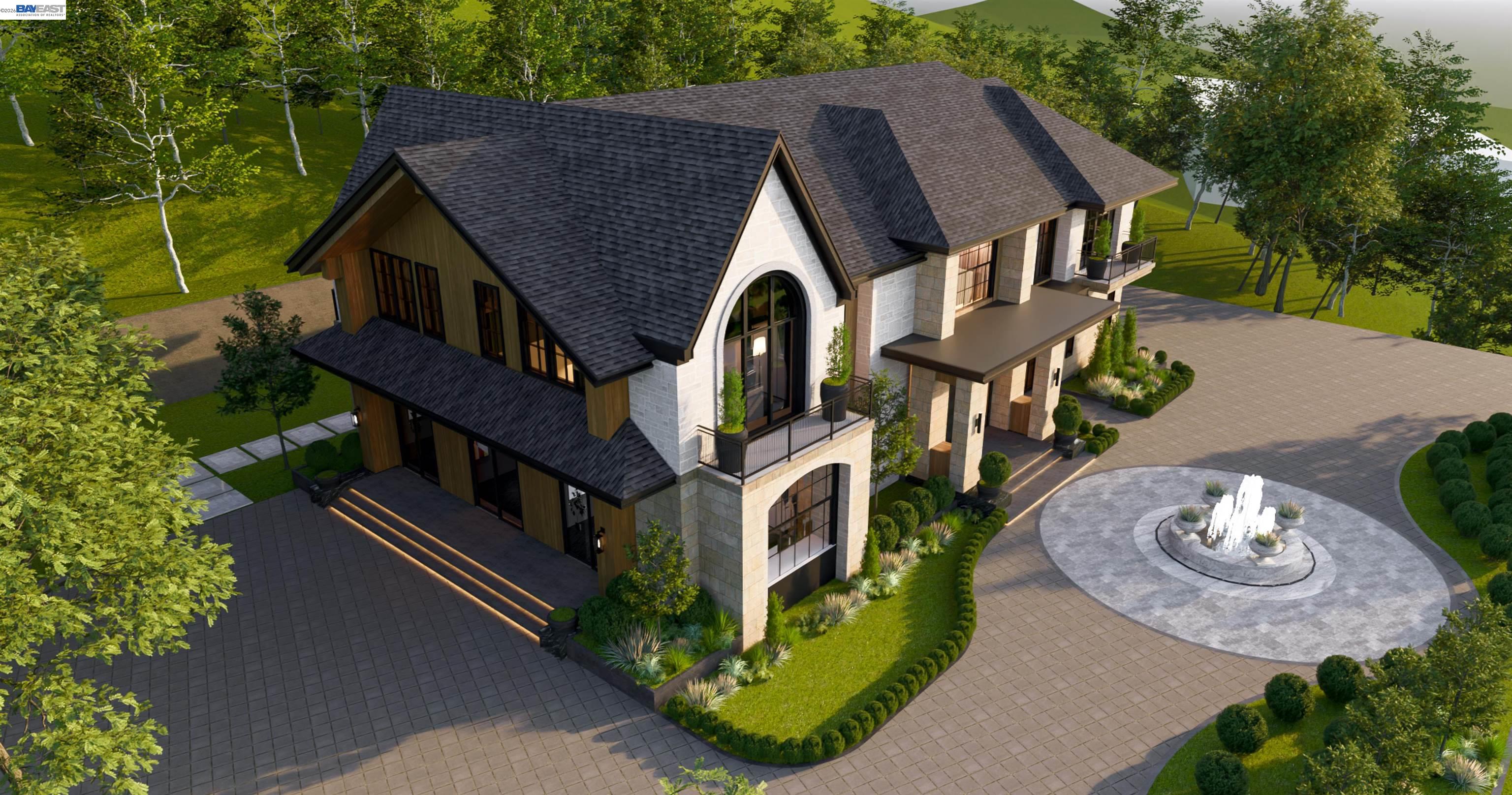 an aerial view of a house with outdoor space and trees all around