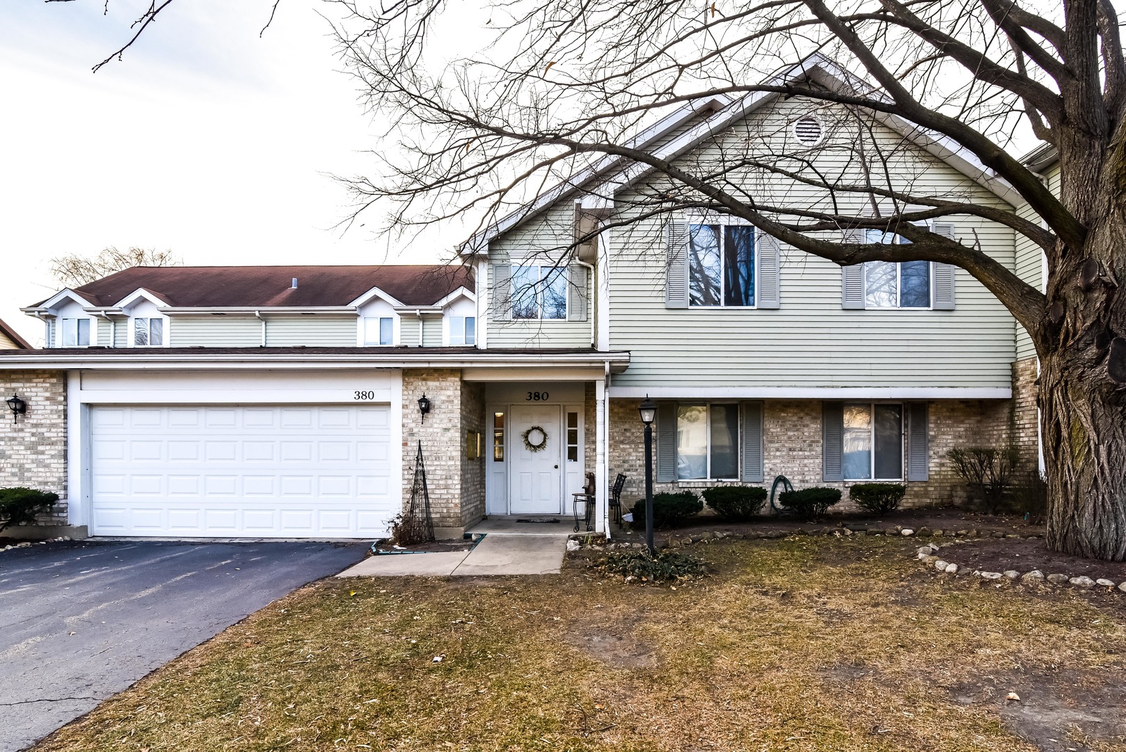 380 Springlake Lane, Unit D Aurora, IL 60504 - Photo 1 of 1 a front view of a house with a yard