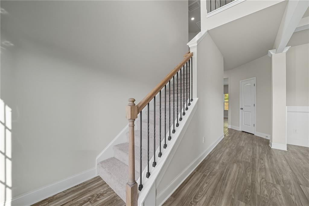 33 North Village Circle Rydal, GA 30171 - Photo 12 of 48 a view of staircase with wooden floor and white walls