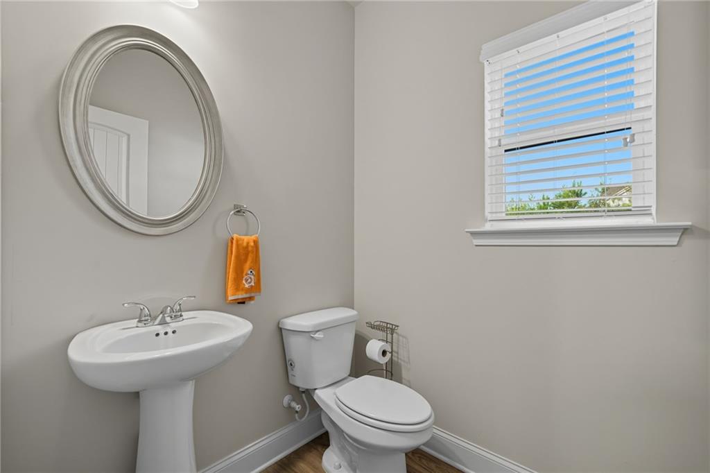33 North Village Circle Rydal, GA 30171 - Photo 16 of 48 a bathroom with a toilet a sink and a mirror