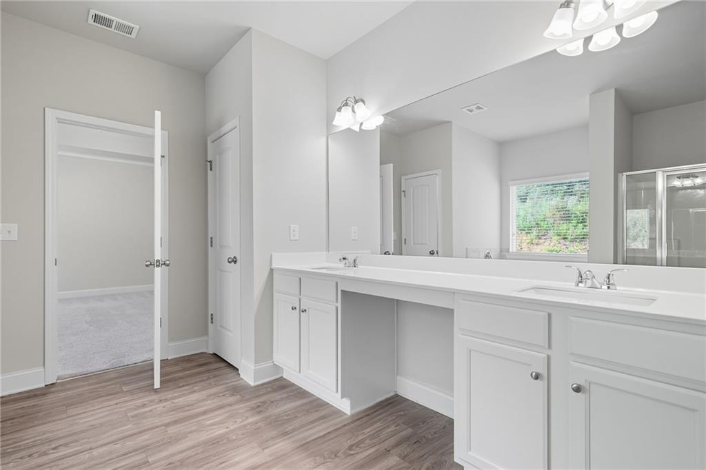 33 North Village Circle Rydal, GA 30171 - Photo 24 of 48 a bathroom with a sink and a mirror