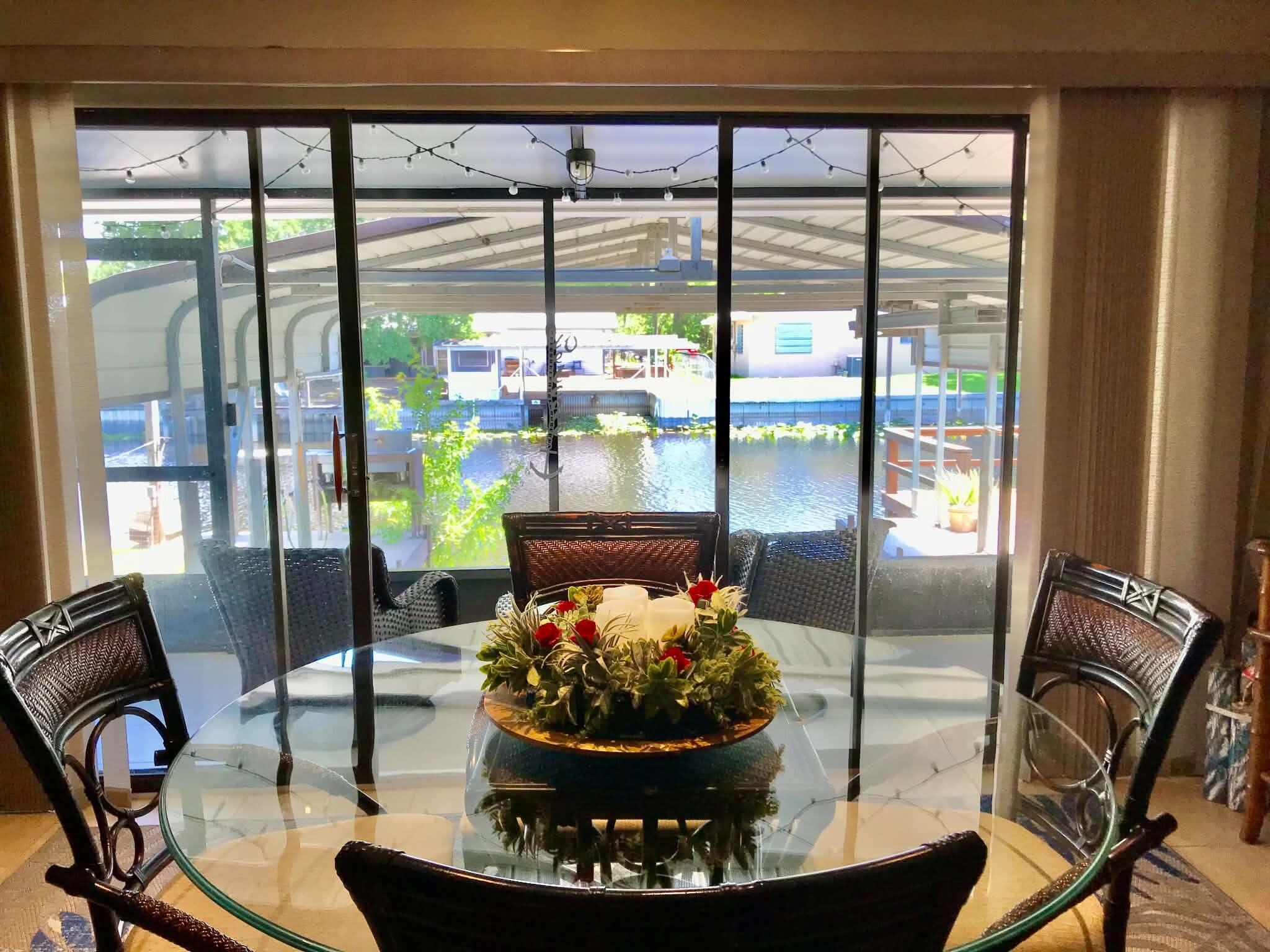 1115 Elm Street Okeechobee, FL 34974 - Photo 8 of 37 a view of a dining room with furniture window and outside view