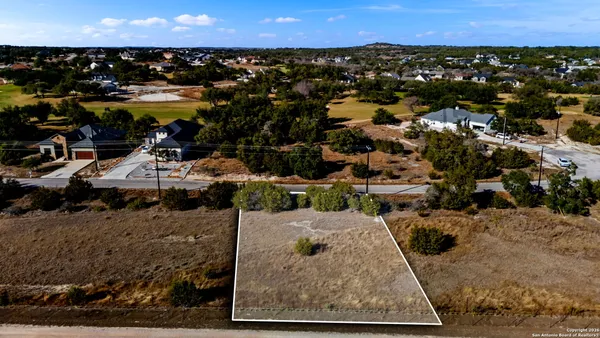 an aerial view of a parking space and city view