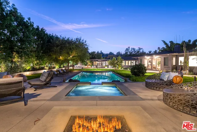 a view of a swimming pool and lounge chair