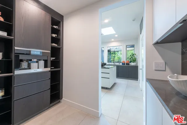 a view of kitchen with furniture and wooden floor