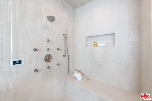 a bathroom with a bathtub and shower