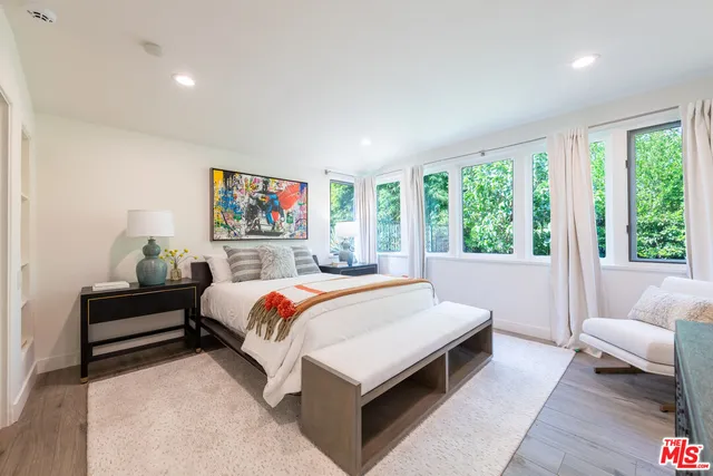 a bed room with a bed and a couch