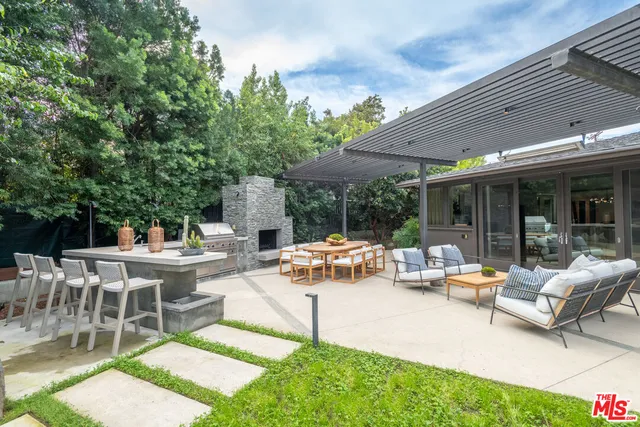 a view of a patio with chairs and table in a patio