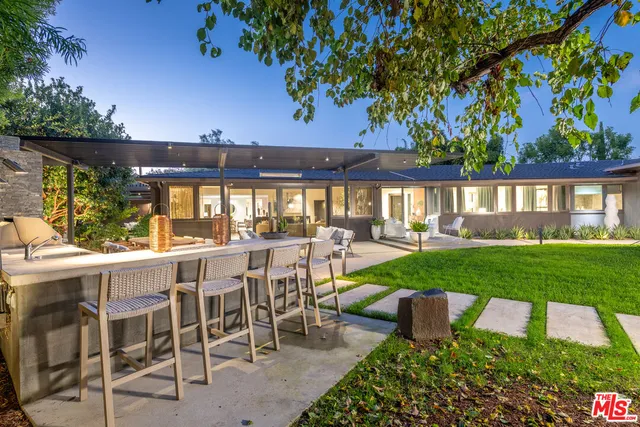 a view of a patio with a garden