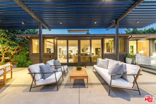 a outdoor living space with furniture and garden view