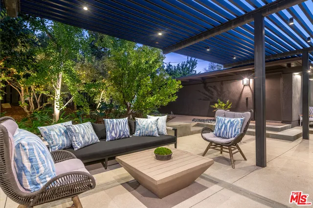 a outdoor living space with furniture and a potted plant