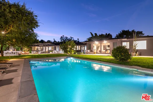 a view of a house with swimming pool