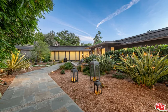 a view of swimming pool with a patio and a yard