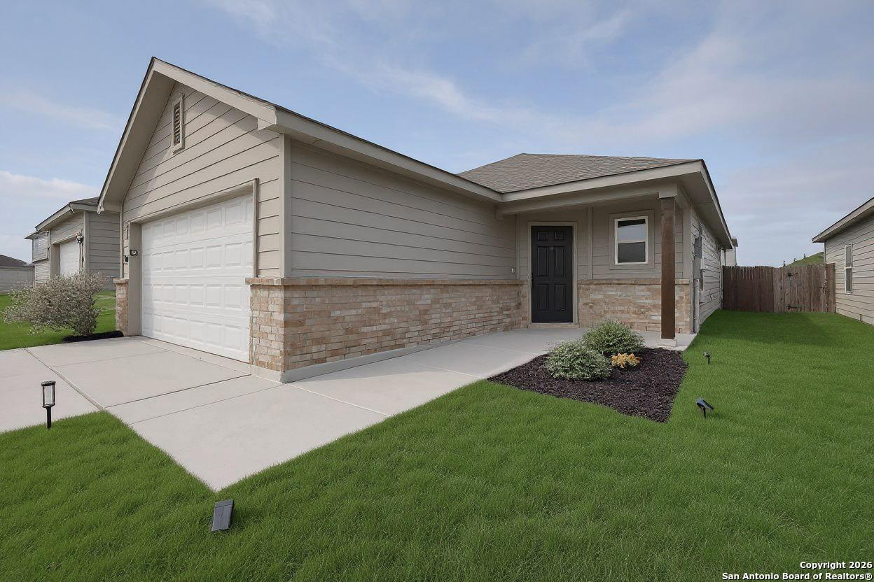 a front view of a house with a yard