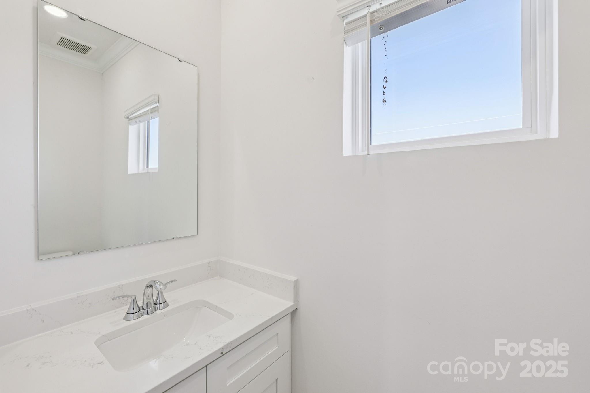 151 Kona Lane Fort Mill, SC 29708 - Photo 12 of 30 a bathroom with a sink vanity and a mirror
