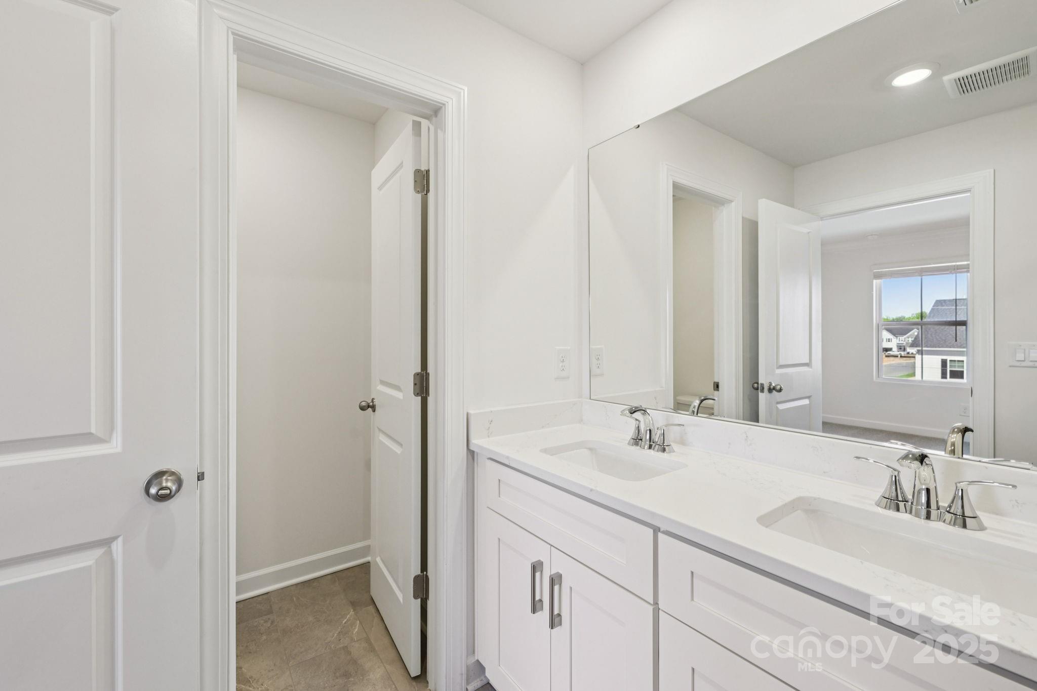 151 Kona Lane Fort Mill, SC 29708 - Photo 20 of 30 a bathroom with 2 sink and a mirror