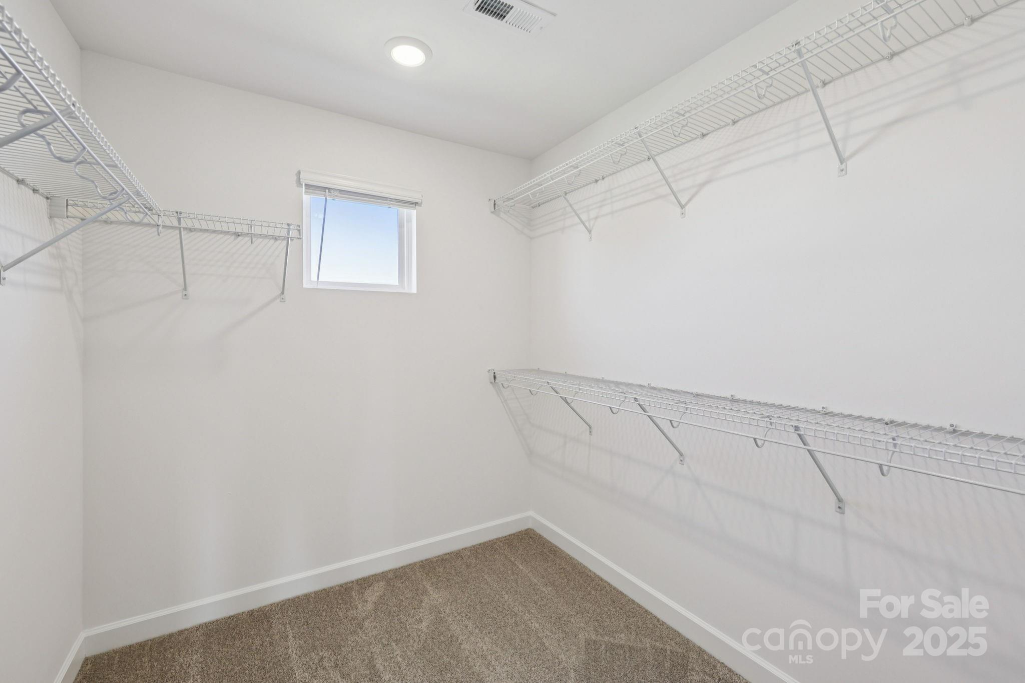 151 Kona Lane Fort Mill, SC 29708 - Photo 22 of 30 a view of a room with racks on the wall