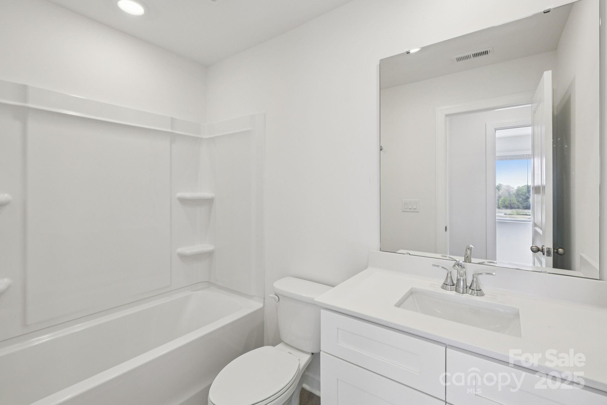 151 Kona Lane Fort Mill, SC 29708 - Photo 25 of 30 a bathroom with a sink a toilet and a bathtub