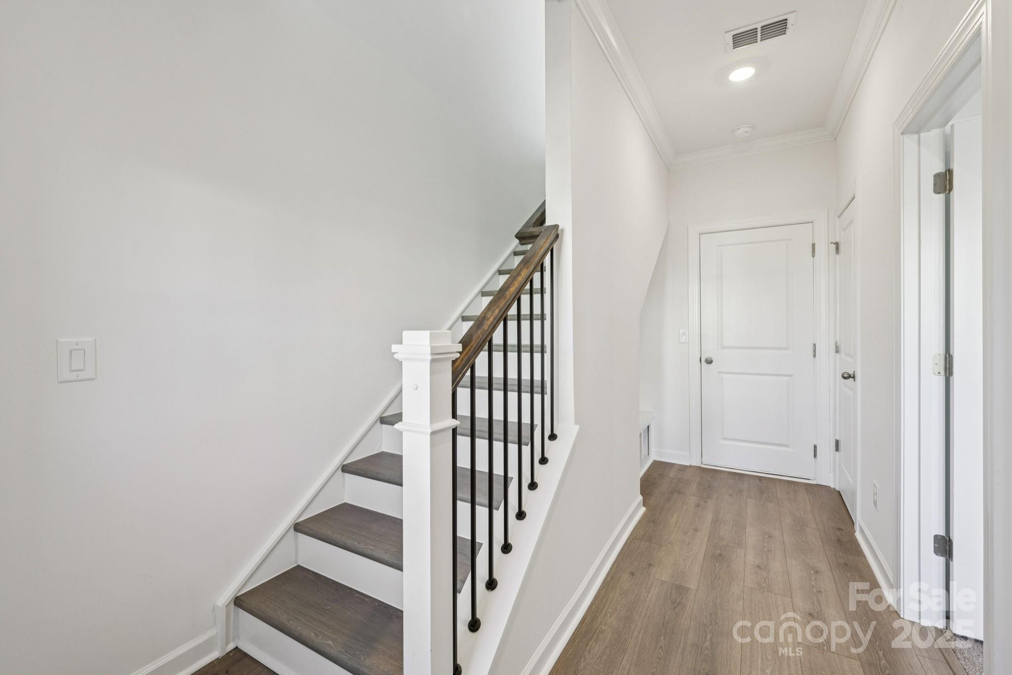 151 Kona Lane Fort Mill, SC 29708 - Photo 4 of 30 a view of a hallway with staircase
