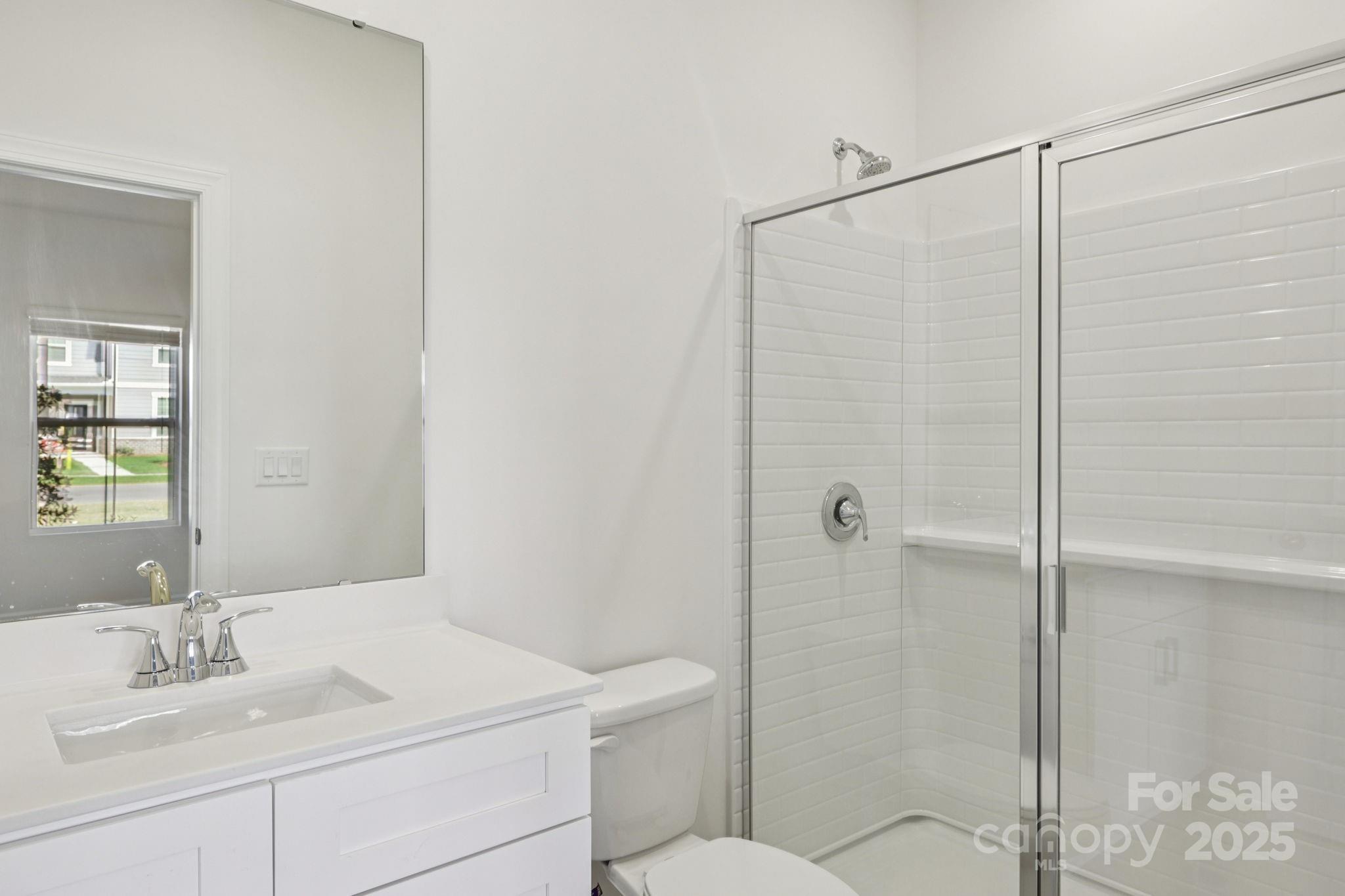 151 Kona Lane Fort Mill, SC 29708 - Photo 6 of 30 a bathroom with a sink toilet and shower