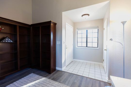 620 East Wilson Avenue Ridgecrest, CA 93555 - Photo 4 of 30 a view of an empty room with wooden floor and closet