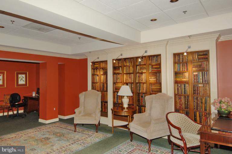 19375 Cypress Ridge Terrace, Unit 1007 Leesburg, VA 20176 - Photo 2 of 19 a living room with furniture and a large window