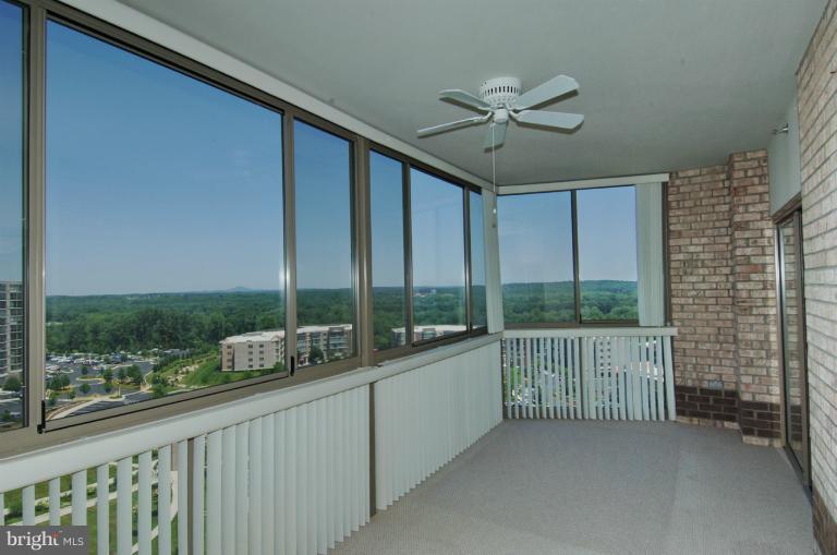 19375 Cypress Ridge Terrace, Unit 1007 Leesburg, VA 20176 - Photo 5 of 19 a view of a city from a balcony