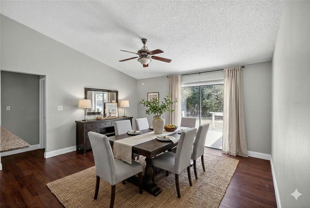 2737 East Dorchester Drive Deltona, FL 32738 - Photo 2 of 32 a view of a dining room with furniture window and wooden floor