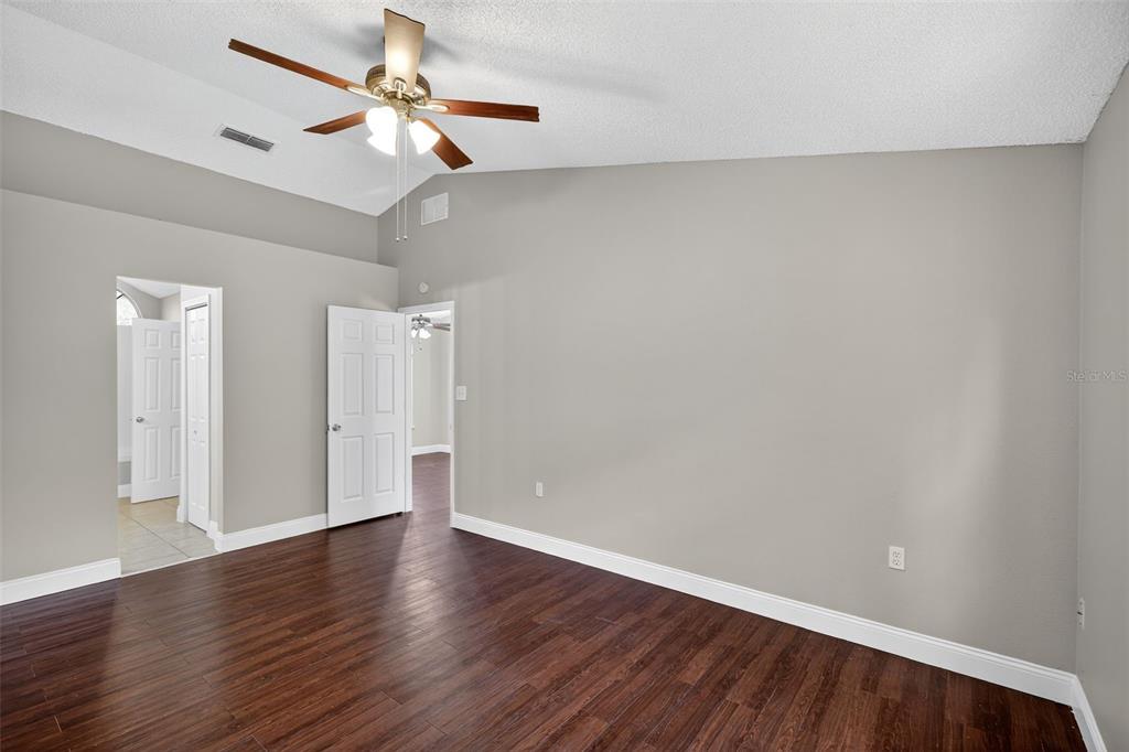 2737 East Dorchester Drive Deltona, FL 32738 - Photo 24 of 32 a view of an empty room with wooden floor