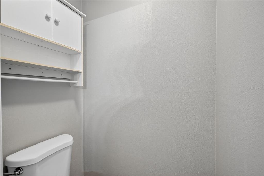 2737 East Dorchester Drive Deltona, FL 32738 - Photo 29 of 32 a white toilet sitting next to a shower