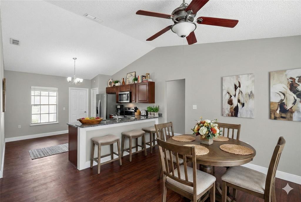 2737 East Dorchester Drive Deltona, FL 32738 - Photo 3 of 32 a view of a dining room with furniture window and wooden floor