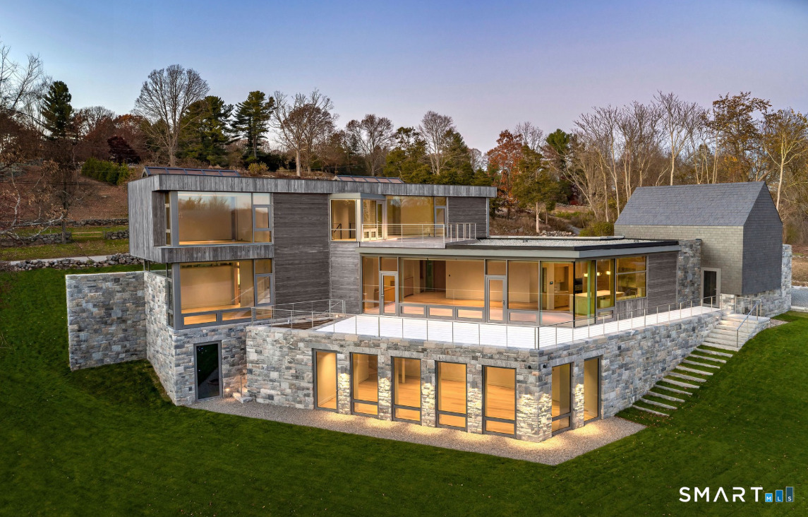 314 Ferry Road Old Lyme, CT 06371 - Photo 1 of 40 Welcome to Greystone, a masterpiece of modern architecture in heart of Old Lyme, CT. Completed in 2024 - Greystone is situated on historic Ferry Road, a short walk to the Connecticut River, marina and close to Old Lyme's renowned village.
