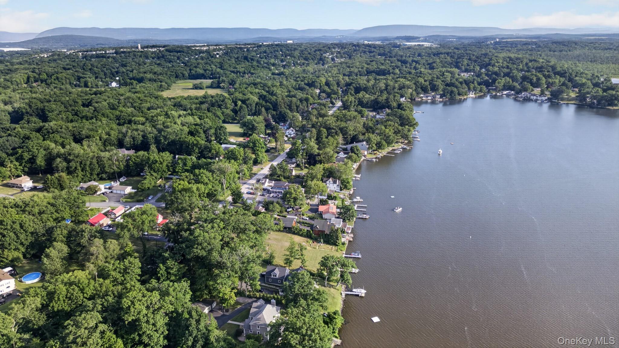 355 Lakeside Road Newburgh, NY 12550 - Photo 7 of 14 Aerial perspective showcasing a waterfront community with extensive tree cover