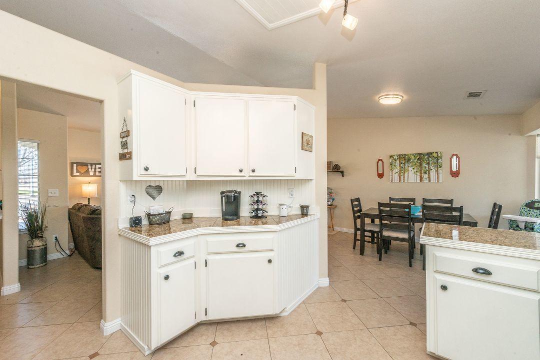 2771 North Street Anderson, CA 96007 - Photo 23 of 55 a kitchen that has a lot of cabinets in it and appliances