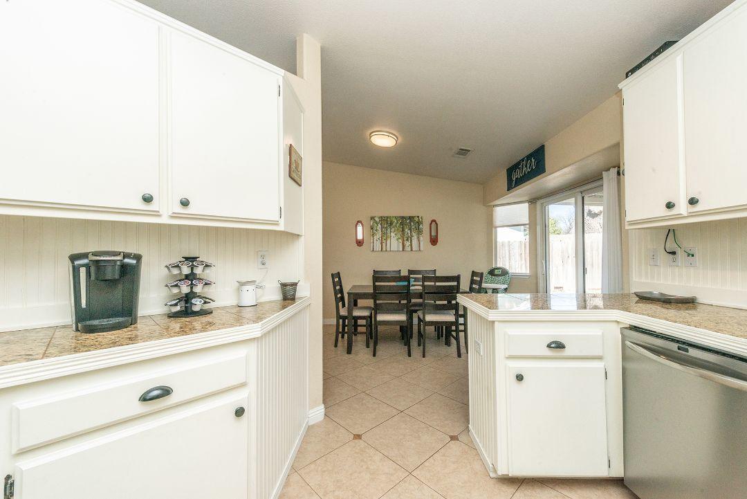 2771 North Street Anderson, CA 96007 - Photo 24 of 55 a kitchen with stainless steel appliances kitchen island granite countertop a sink and cabinets