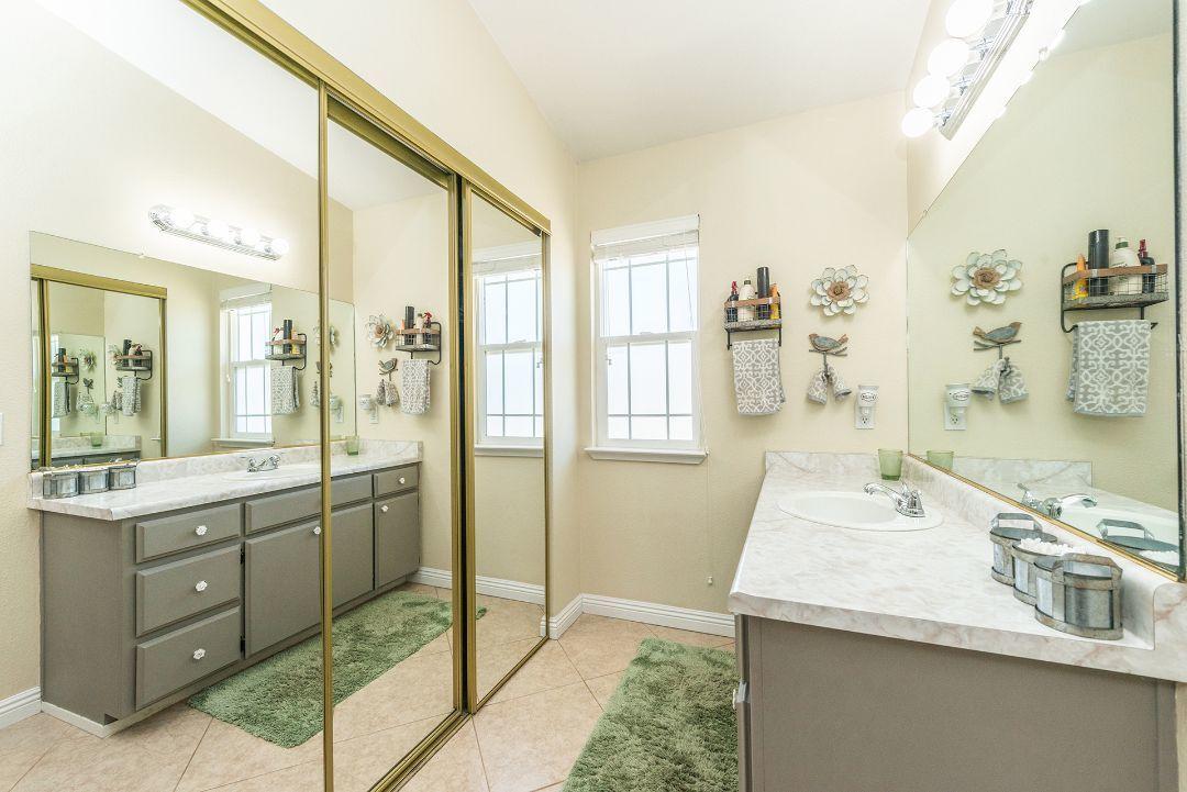 2771 North Street Anderson, CA 96007 - Photo 25 of 55 a bathroom with a sink and a mirror