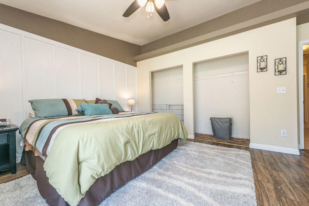 2771 North Street Anderson, CA 96007 - Photo 27 of 55 a bedroom with a bed and a chandelier