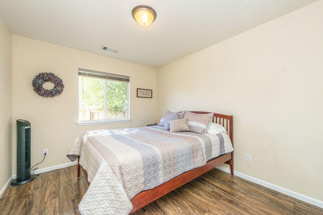 2771 North Street Anderson, CA 96007 - Photo 29 of 55 a bedroom with a bed and a window